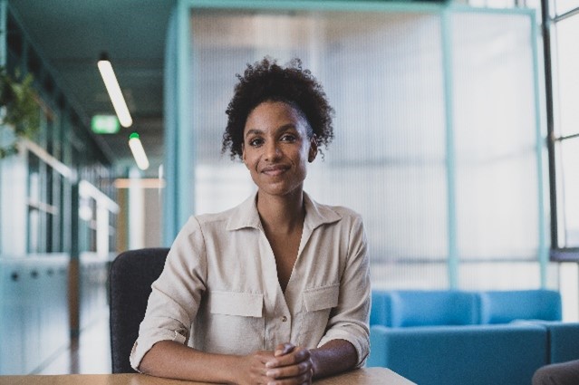 Young professional woman focused during a leadership discussion